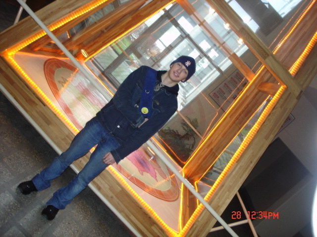 Me as a student, standing in front of the Foucault pendulum at university